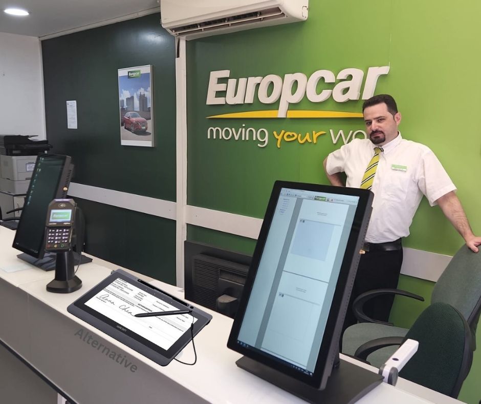 euro car executive is proudly posing to demonstrate upgradation to wacom electronic signature